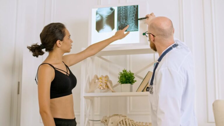doctor shows young woman her xray evaluating patients condition